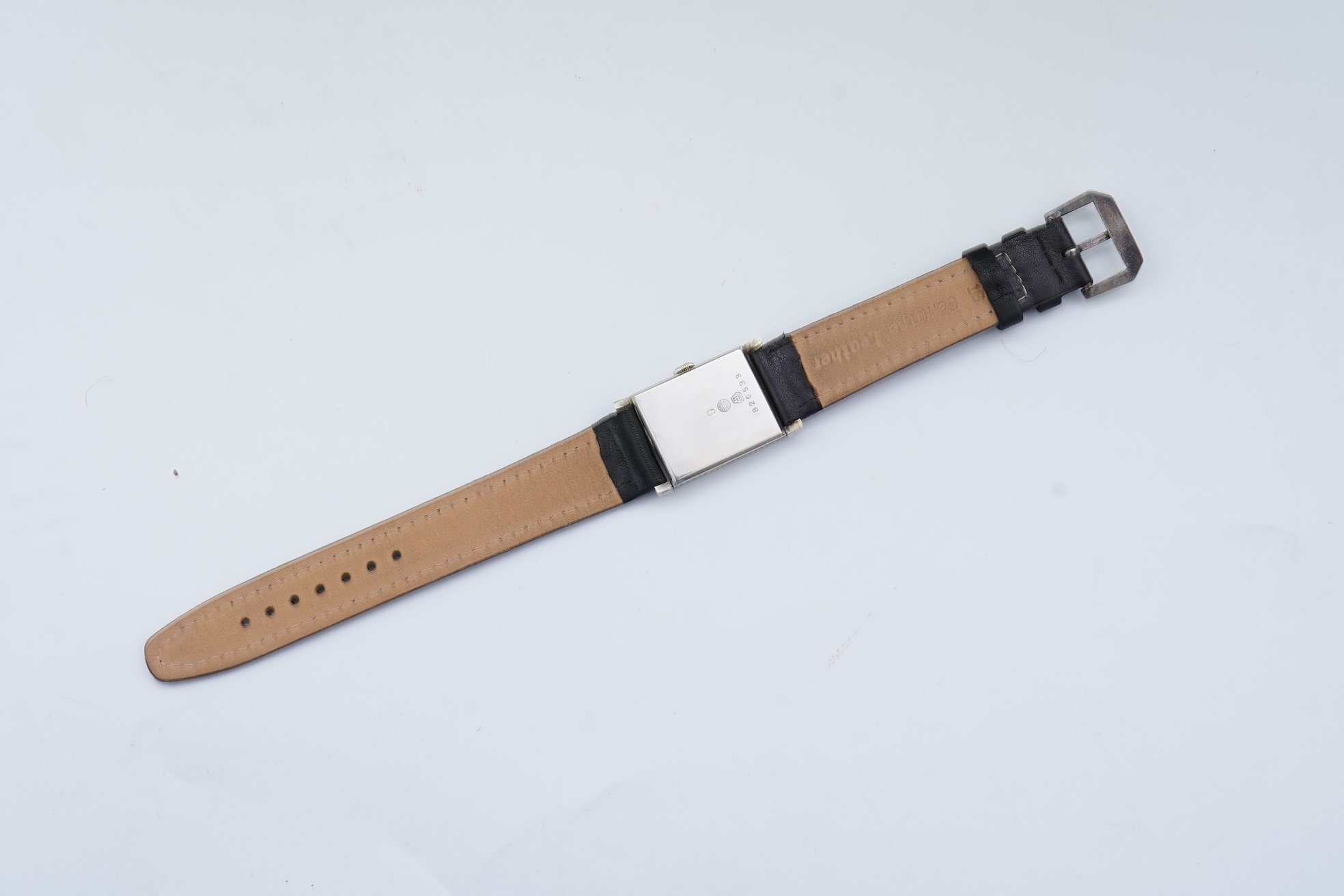A lady's 18k white gold International Watch Company manual wind wrist watch, on a later associated leather strap